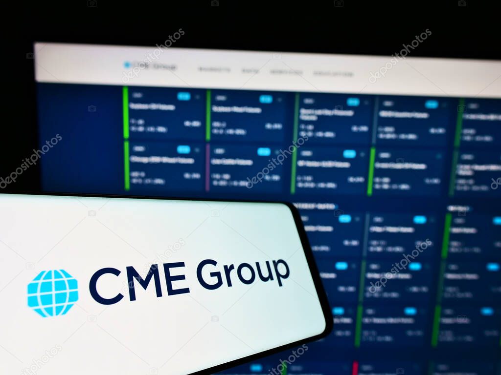 STUTTGART, GERMANY - Jun 07, 2021: Smartphone with logo of US financial services company CME Group Inc. on screen in front of business website. Focus on center-left of phone display.