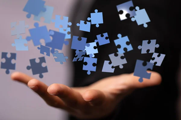 Blue Rendered Puzzle Pieces Floating Man Hand — Stock Photo, Image