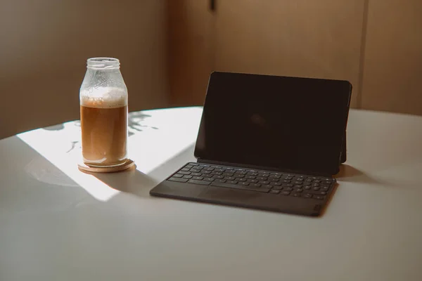 Closeup Black Tablet Keyboard Attached Next Bottle Iced Coffee Desk — Stock Photo, Image