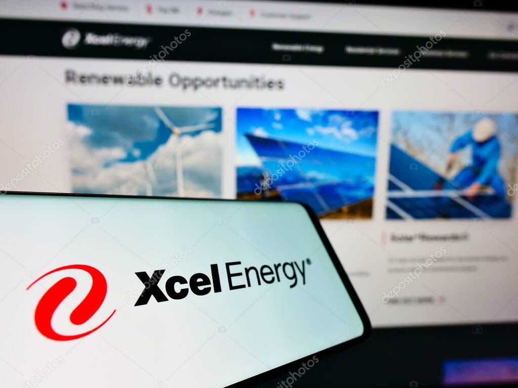 STUTTGART, GERMANY - Jun 01, 2021: Smartphone with logo of US utility company Xcel Energy Inc. on screen in front of business web page. Focus on center-left of phone display.