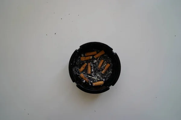 Top View Shot Smoked Out Cigarettes Black Ashtray White Surface — Stock Photo, Image