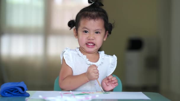 Angry Asian Girl Painting Brush Sheet Paper — Stock video