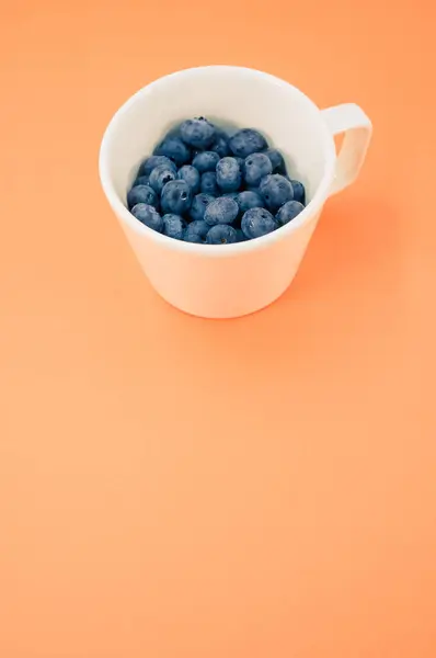 View Sweet Tasty Blueberries Plate Orange Background Text Space — Stock Photo, Image