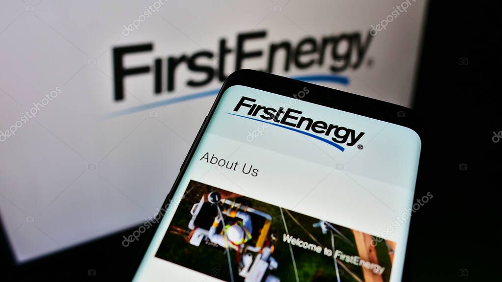 STUTTGART, GERMANY - May 22, 2021: Cellphone with business website of US electric utility company FirstEnergy Corp. on screen in front of website. Focus on top-left of phone display.
