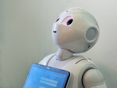 TURIN, ITALY - Feb 14, 2020: The robot Pepper by SoftBank Robotics. First humanoid assistant for better customer experience. clipart