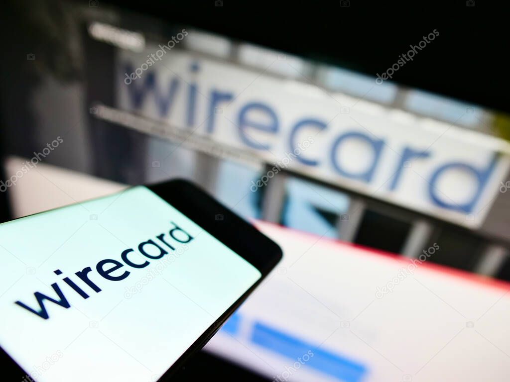 STUTTGART, GERMANY - Sep 13, 2021: Mobile phone with logo of German payment and financial services company Wirecard AG in front of website. Focus on center-left of phone display.
