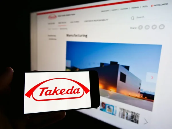 Stuttgart Germany Feb 2021 Person Holding Cellphone Logo Japanese Takeda — Stock Photo, Image