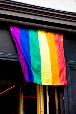 A beautiful shot of LGBTQ flags on a street building clipart