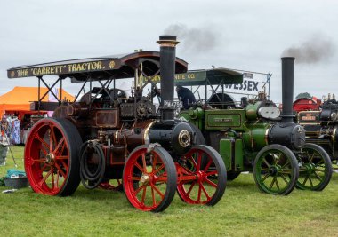 SHAFTSBUR, UNITED KINGDOM - Aug 19, 2021: A line of several steam engines at the Gillingham and Shaftesbury show, Shaftsbury, United Kingdom clipart