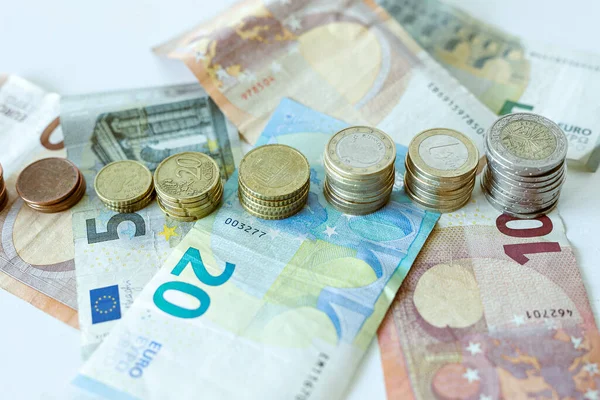 Shot Euro Coin Piles Banknotes White Surface Finances Investment Concept — Stock Photo, Image