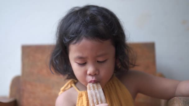 Girl Eating Cold Ice Cream While Sitting Chair — Video