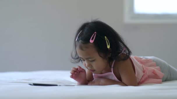 Adorable Asian Little Girl Using Tablet — стоковое видео