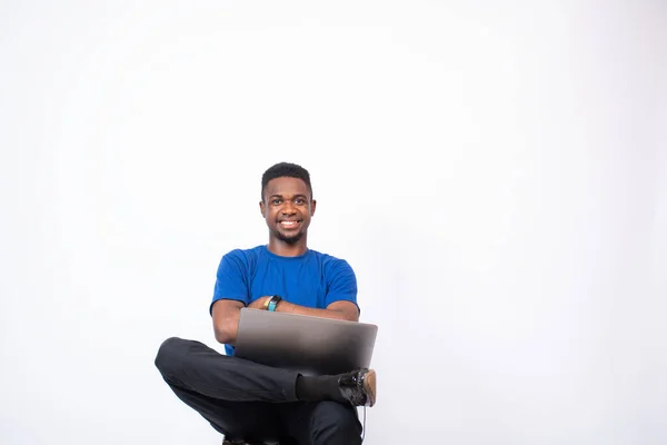 Closeup Shot Young African Male Sitting His Laptop Front White — ストック写真