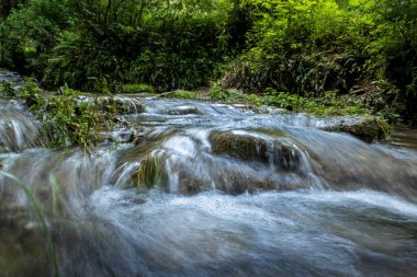 A beautiful view of flowing water in the river with long exp clipart