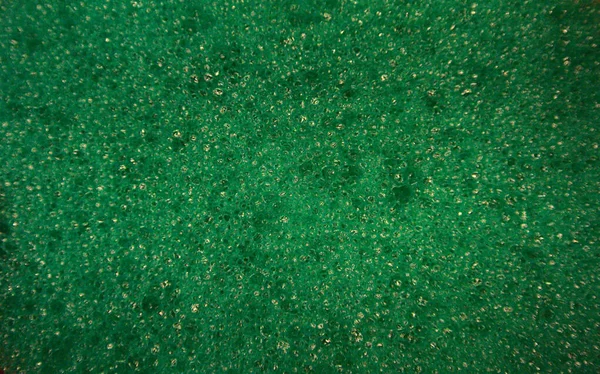 Крупный План Блестящей Зеленой Поверхности Напоминающей Траву Заднем Плане — стоковое фото