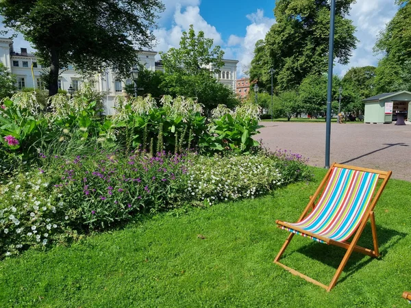 Wooden chaise lounge for relaxing in a garden