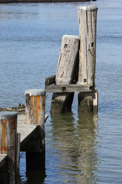 Vertical Shot Wooden Piers River Sunny Day Stock Photo