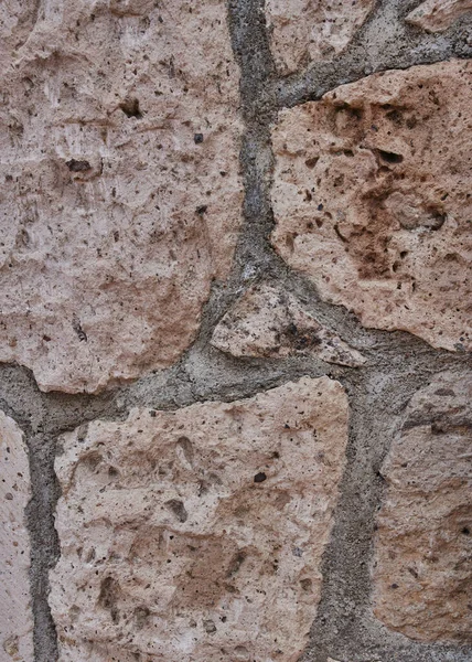 装飾的な住宅パターンを形成する小さな象眼細工の石の壁 — ストック写真