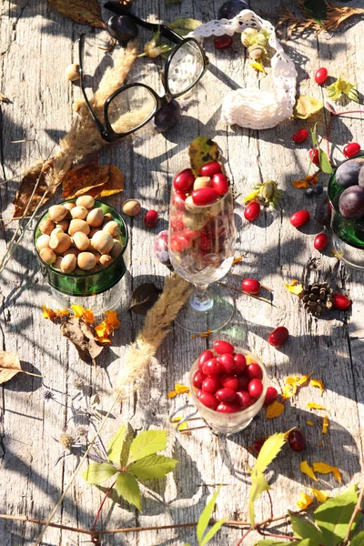 Various Types Berries Hazelnut Autumn Leaves Glasses Wooden Table — Stock Photo, Image