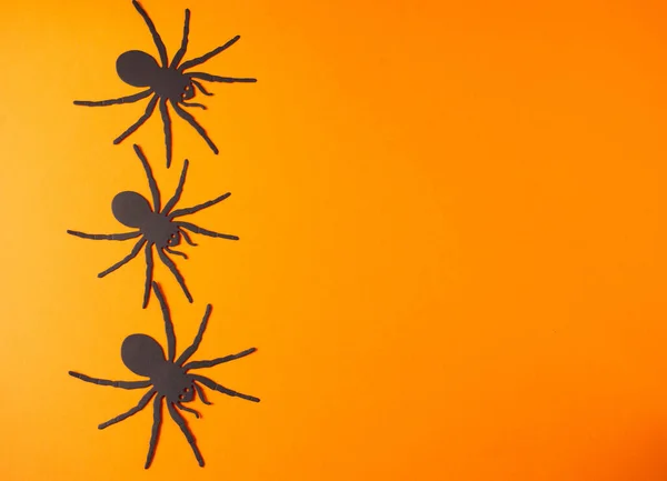 Vibrant Orange Background Metallic Black Widow Spiders Corner Copy Space — Stock Photo, Image