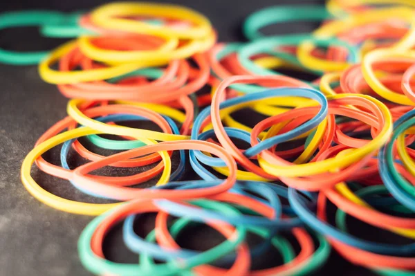 A closeup blurry shot of colorful elastic rubber bands