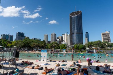 BRISBAEN, AUSTRALIA - Aug 10, 2021: A breathtaking view of Brisbane downtown. People are enjoying summer and good weather on the street. clipart
