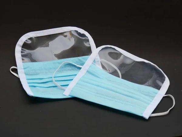 Primer Plano Par Máscaras Médicas Azules Con Fondo Negro —  Fotos de Stock