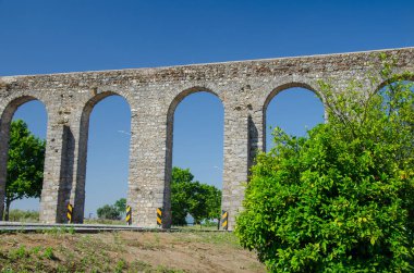 An aged viaduct bridge in Evora, Portugal clipart
