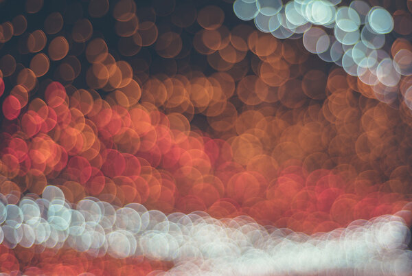 Combination of yellow,white and red bokeh lights with fade filter applied