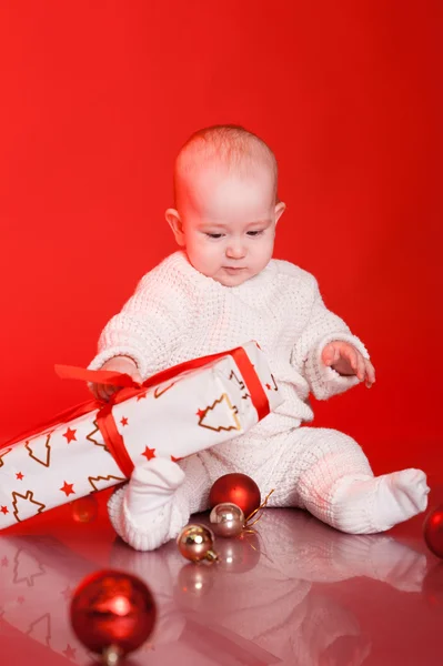 Baby boy with presents — Stock Photo, Image