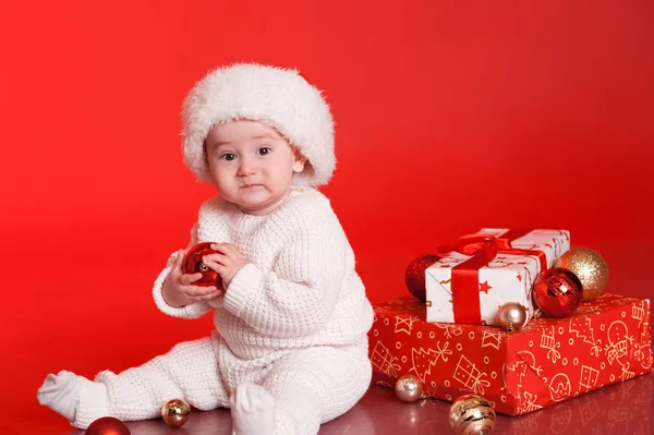 Baby boy with presents — Stock Photo, Image