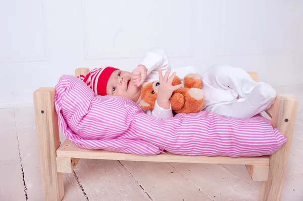 Baby sleeping with teddy bear — Stock Photo, Image