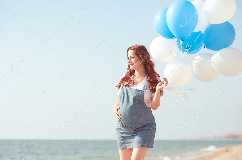 Pregnant woman with balloons