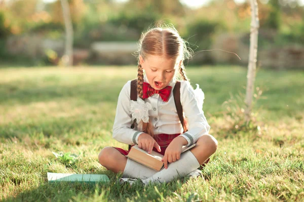 Little girl wearing school uniform — Stock Photo, Image