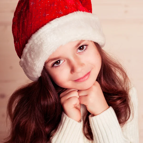 小さな女の子を着てサンタの帽子 — ストック写真