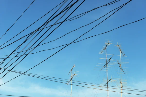 Television antenna on blue sky — Stock Photo, Image