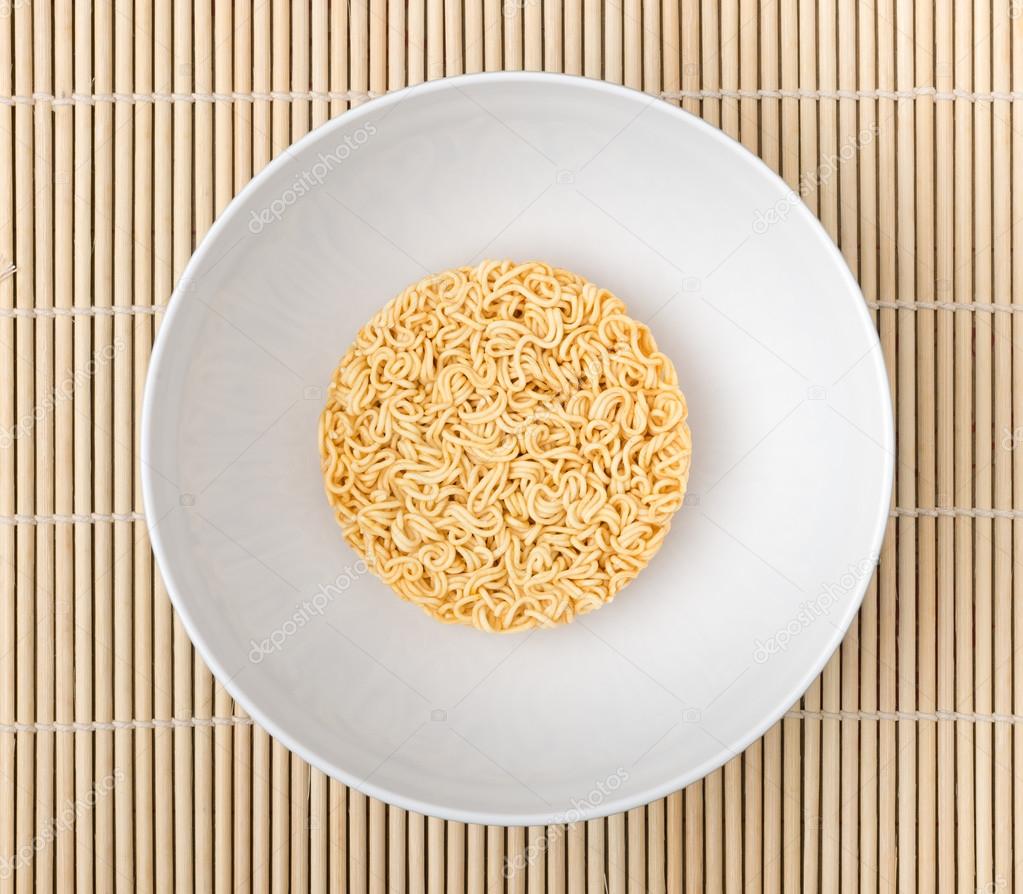 Instant noodles on wood background