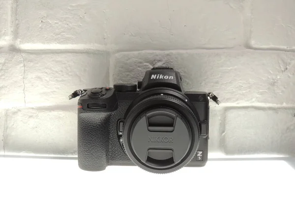 Nikon Z5 full frame mirrorless camera with 24-50mm VR lens. Light background. An entry-level full-frame mirrorless camera.