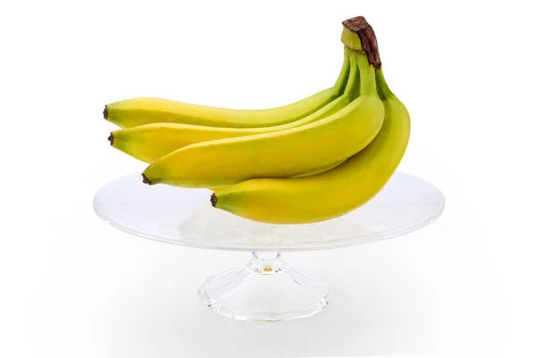 Банановая Связка Прозрачной Стеклянной Подставки Изолированные Белом Фоне — стоковое фото