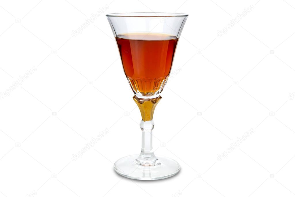 Marsala wine in goblet glass with gold decoration. Isolated on white, copy space