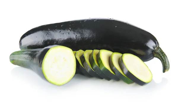 Whole courgettes and cut into slices on white — Stock Photo, Image