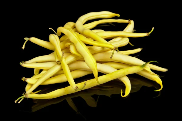 Stack of yellow beans on black background — Stock Photo, Image