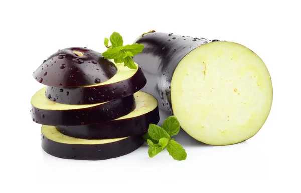 Sliced aubergine, eggplant with basil leaves isolated white — Stock Photo, Image