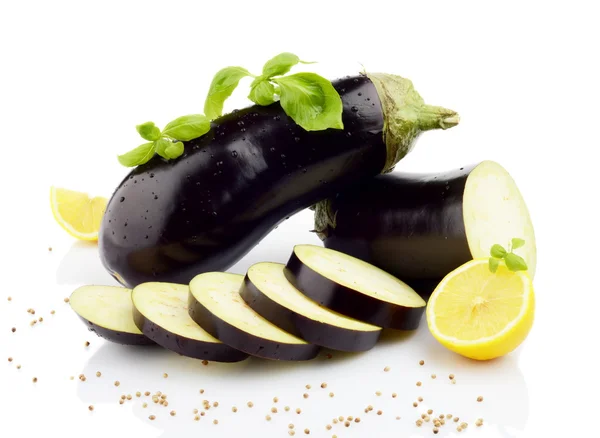 Sliced eggplants basil leaves,lemons,black pepper isolated white — Stock Photo, Image