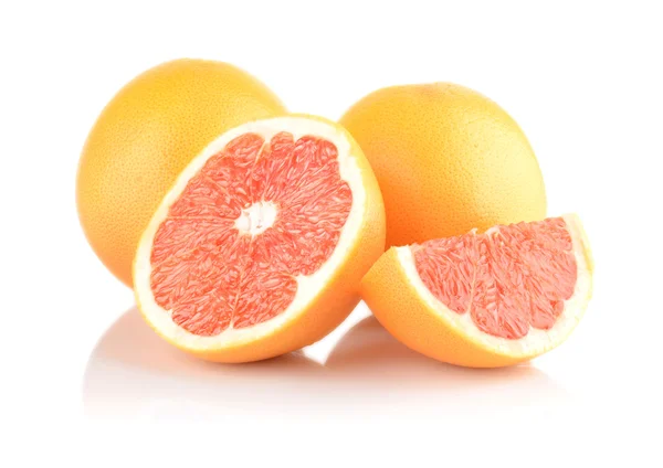 Studio shot sliced some grapefruits isolated white — Stock Photo, Image