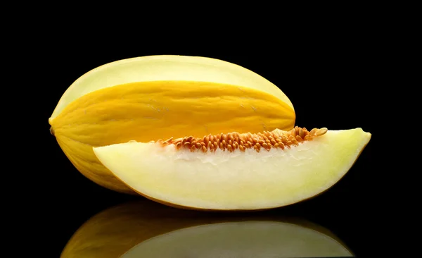 Studio shot of sliced Canary melon isolated black — Stock Photo, Image