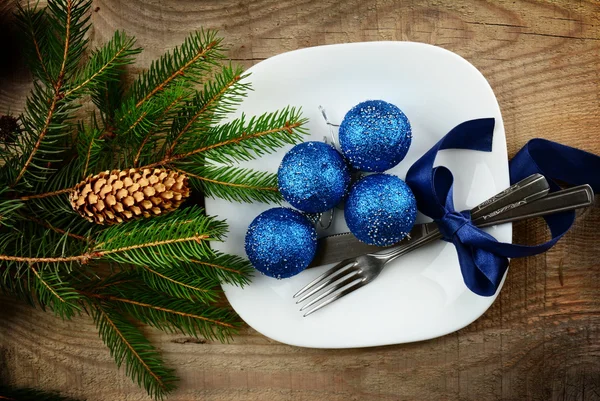 Christmas plate blue baubles pines wooden surface — Stock Photo, Image