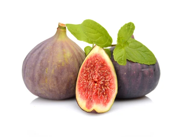 Three sliced figs with mint isolated on white background — Stock Photo, Image