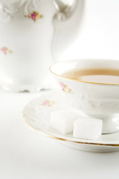 Studio shot cut image in old-style jug with tea on white backgro — Stock Photo, Image