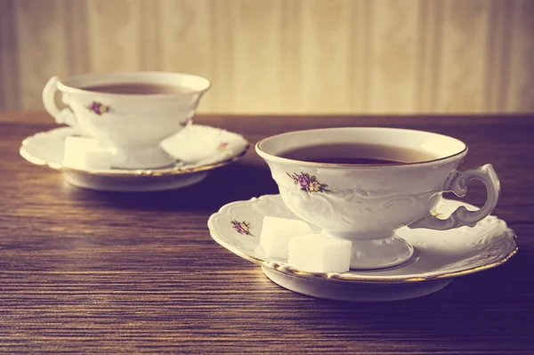 Old-fashioned image with two cups of tea vintage effect — Stock Photo, Image